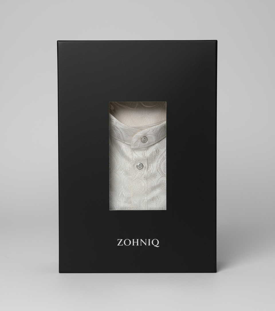 A folded white kurta with a subtle geometric pattern, displaying a band collar and full sleeves.